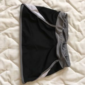A nike black white and grey athletic skort.